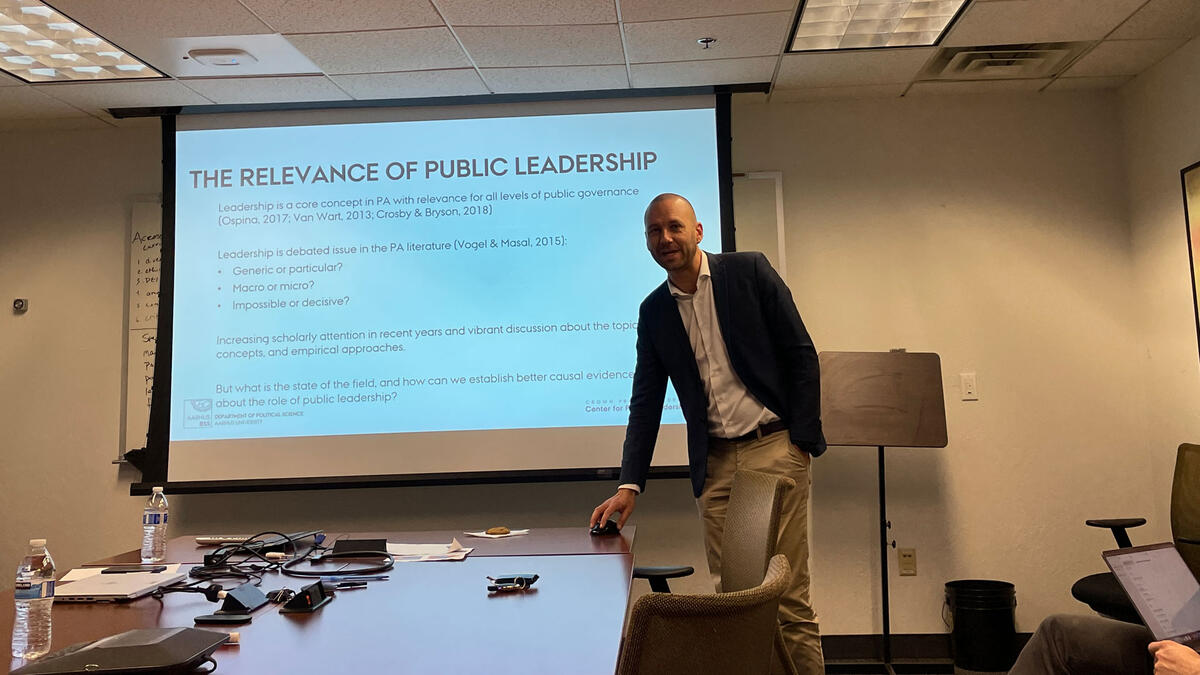person presenting slide on public leadership